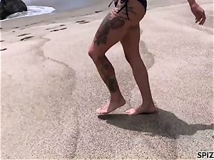 Anna Bell Peaks nailing a immense beef whistle on the beach